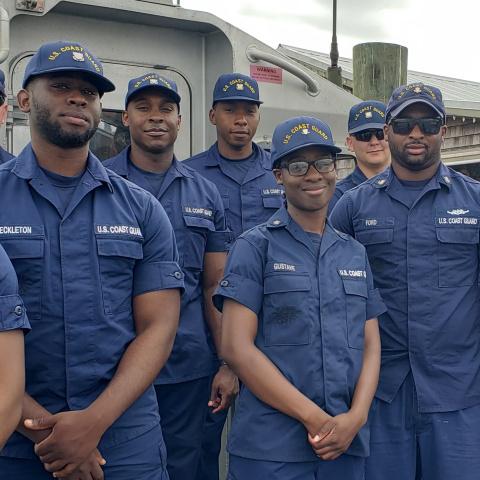 Coast Guard enlisted members on flight deck.